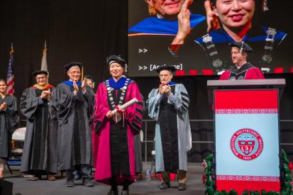 President Grace Wang stands on stage after officially being installed at President