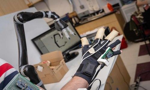 a wearable robotic arm in a lab setting