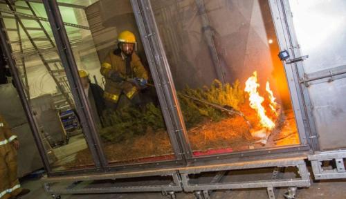 Firefighter and wildfire in wind tunnel