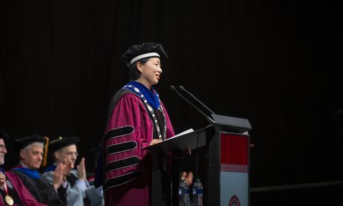WPI President Grace Wang stands at the podium and delivers her inaugural address.