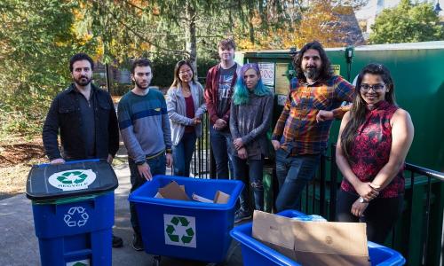 WPI Assistant Professor Berk Calli will work with students on a project to develop robotics technologies for recycling centers. From left, James Akl, Fadi  Alladkani, Arianna Kan, Kyle Heavey, Mikayla Fischler, Calli and Snehal Dikhale. alt