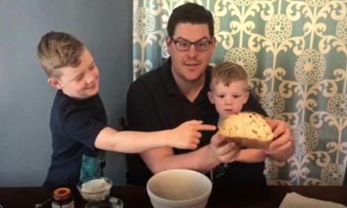 Chemical engineer Eric Young bakes with his children. alt
