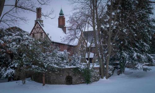 A photo of Higgins House after a snowstorm.