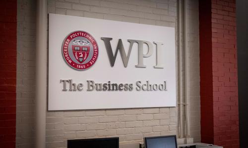 WPI Business School sign on wall