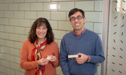 WPI researchers Suzanne Scarlata and Nima Rahbar hold pieces of their sustainable construction material
