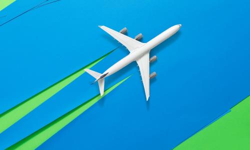 Passenger aircraft on blue background with green chemtrails